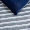 imageNautica  TwinTwin XL Bed Set Reversible Comforter with Matching Shams Bed Sheets and Laundry Bag Dorm Essentials Captains BlueGreenHeathered Block Flagstone
